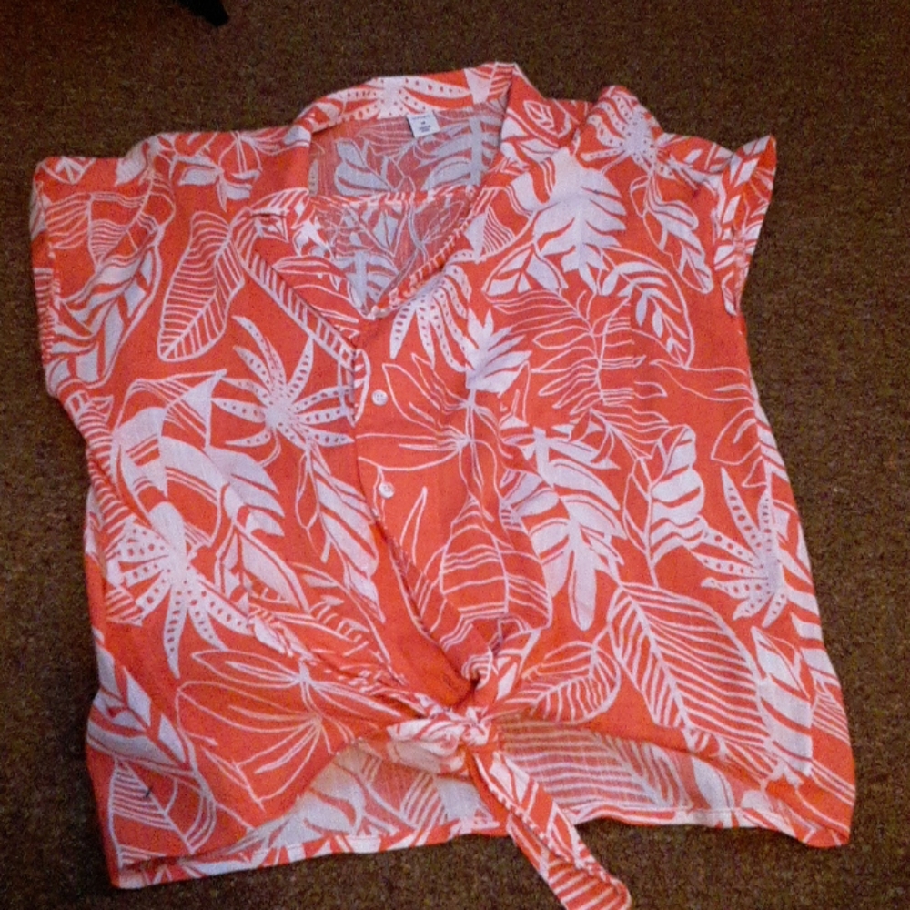 A button up pink, and white floral shirt